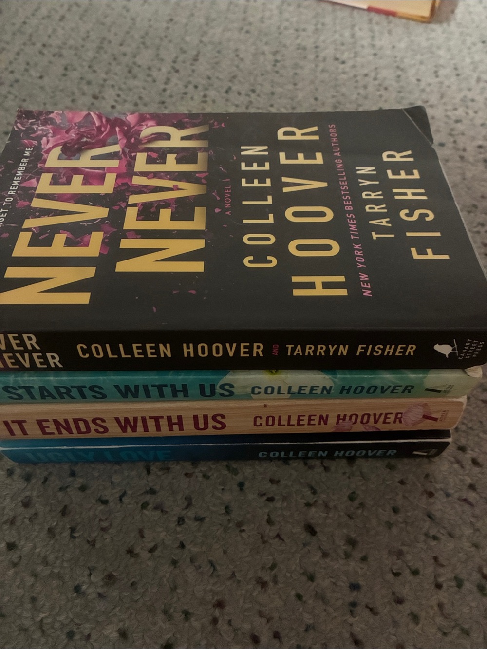 Paperback Book Stack - Black, Teal, Pink, Blue Covers
